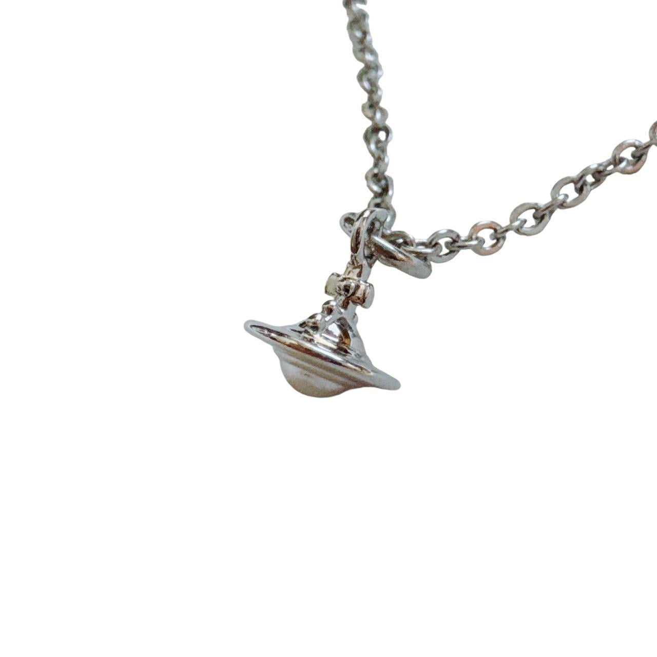 silver cross saturn necklace
