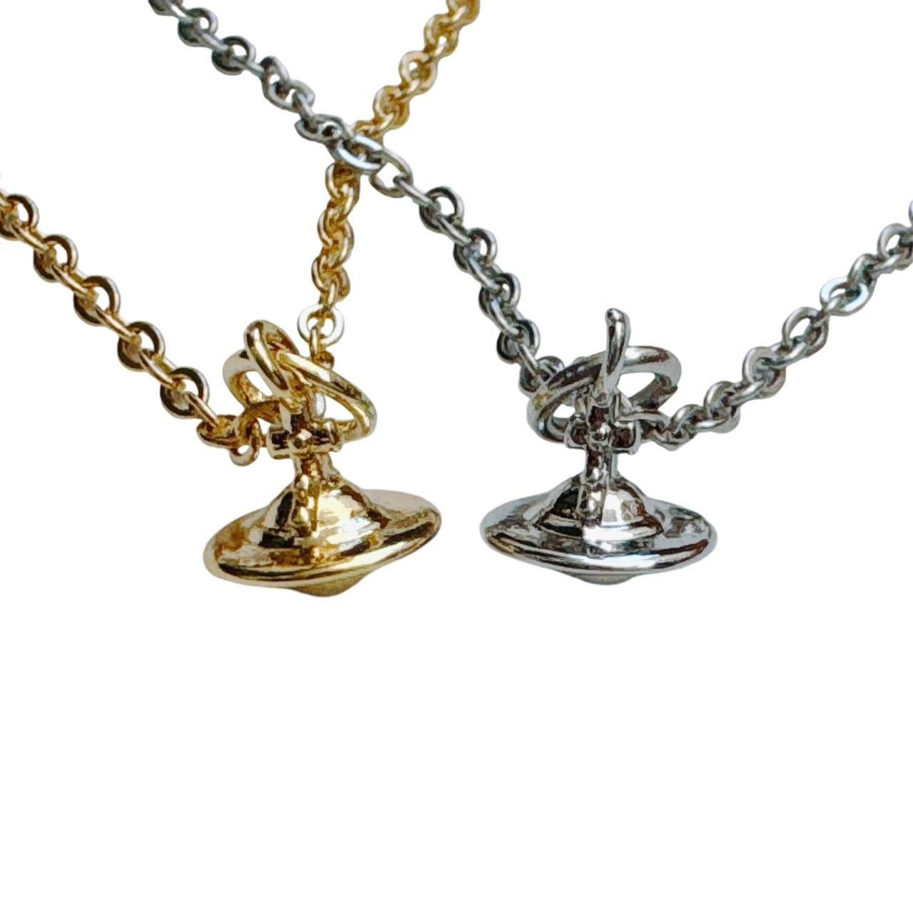 silver cross saturn necklace