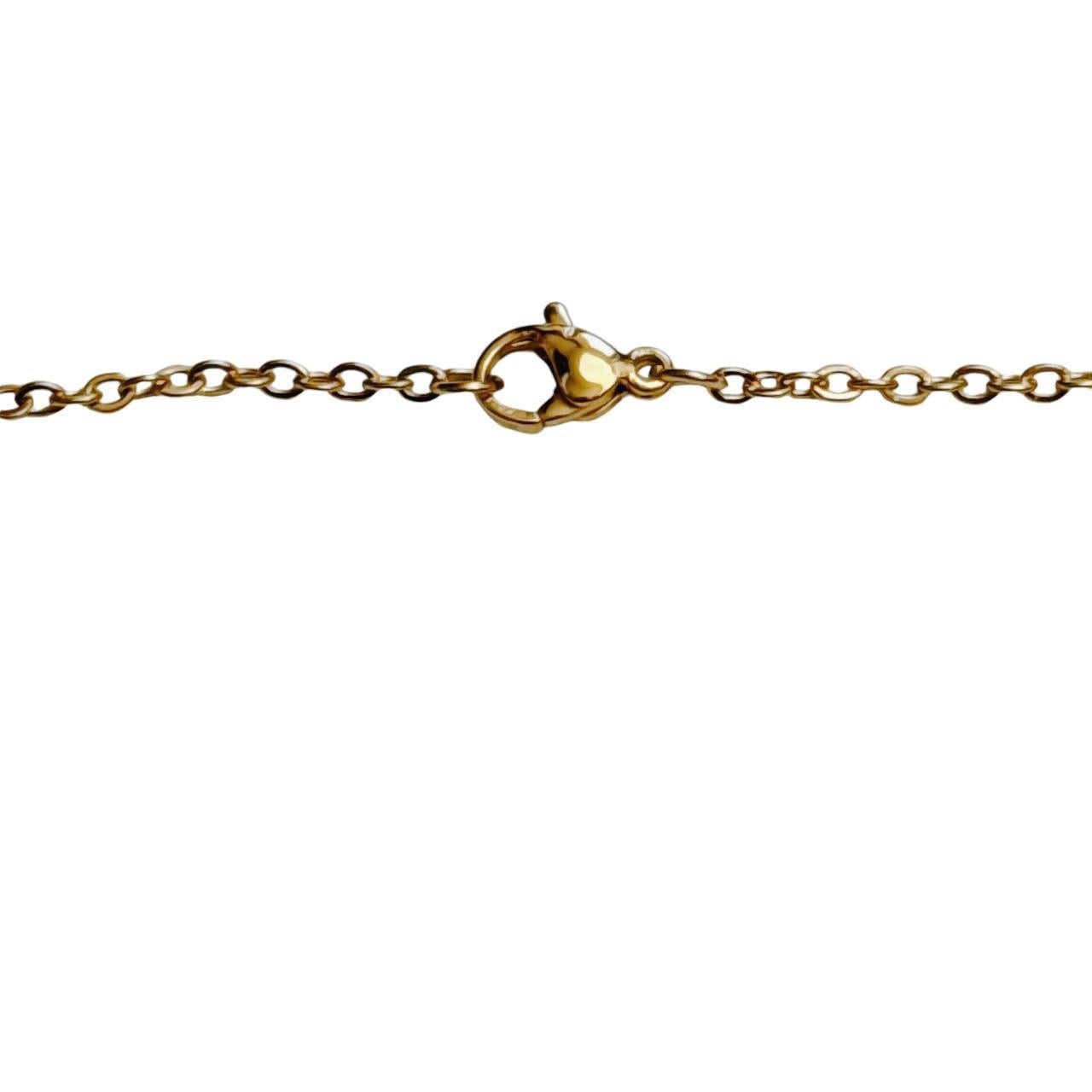 gold cross saturn necklace