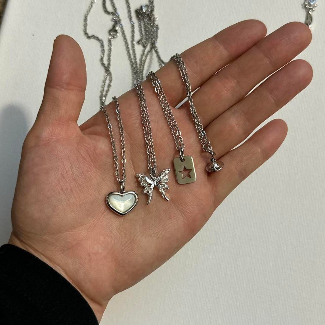 silver cross saturn necklace
