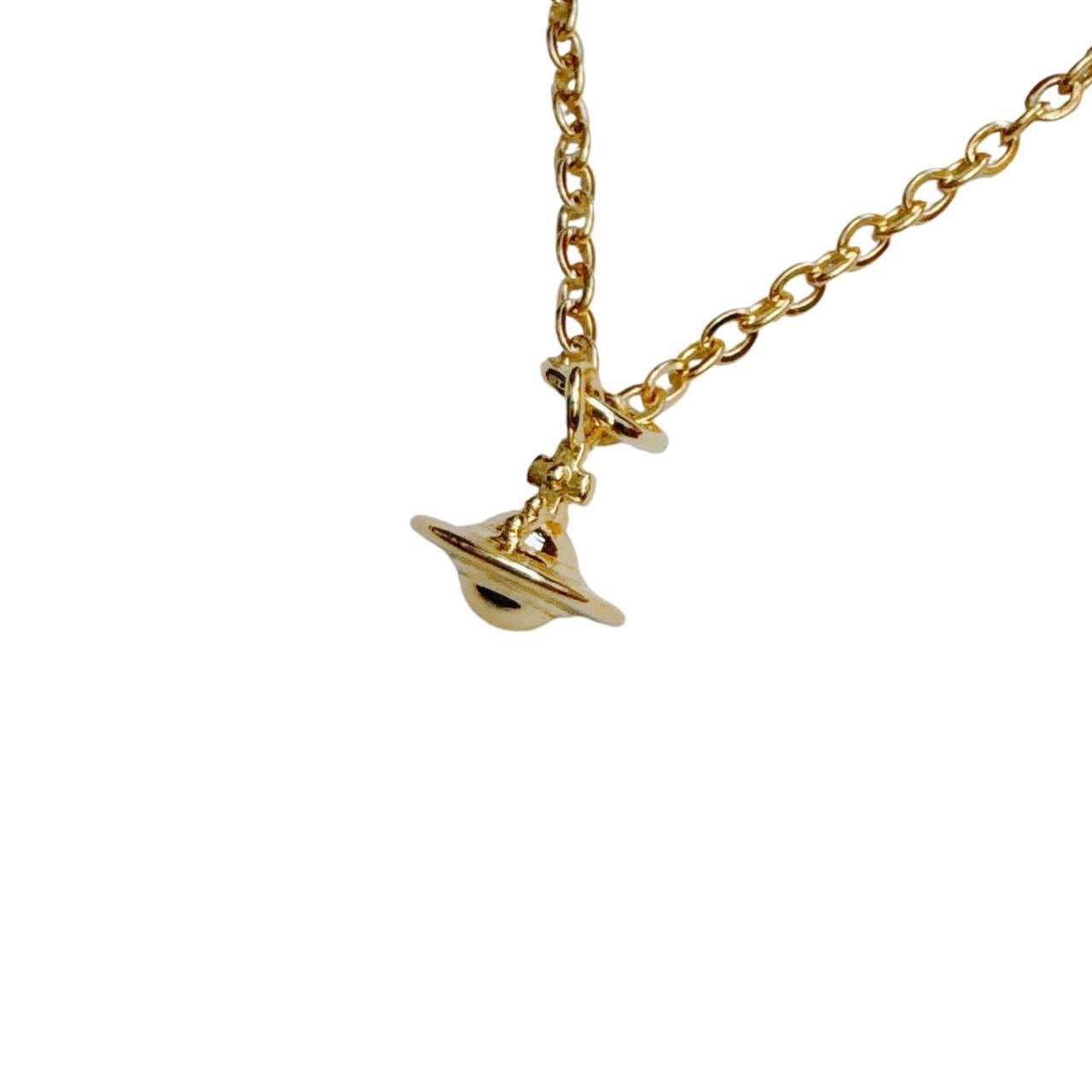 gold cross saturn necklace