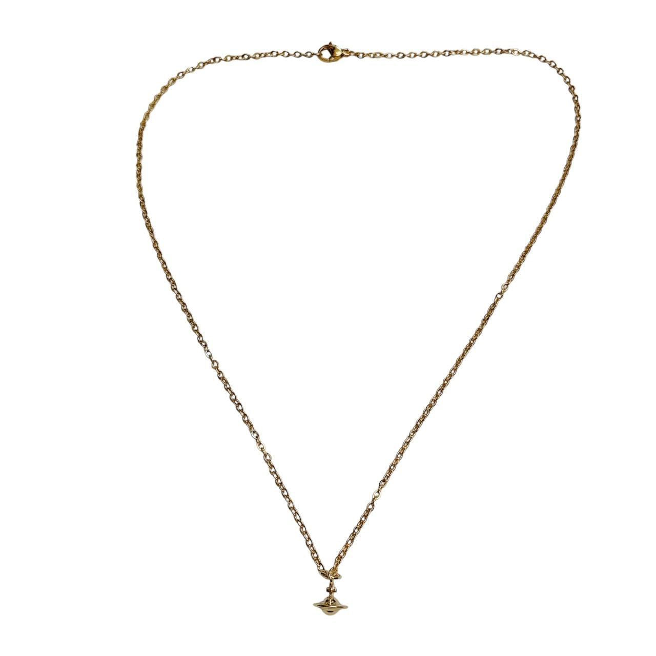 gold cross saturn necklace