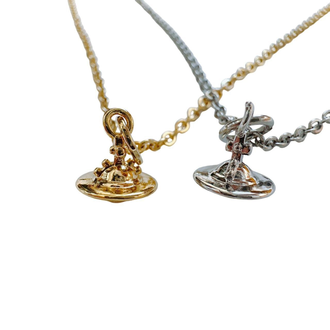gold cross saturn necklace