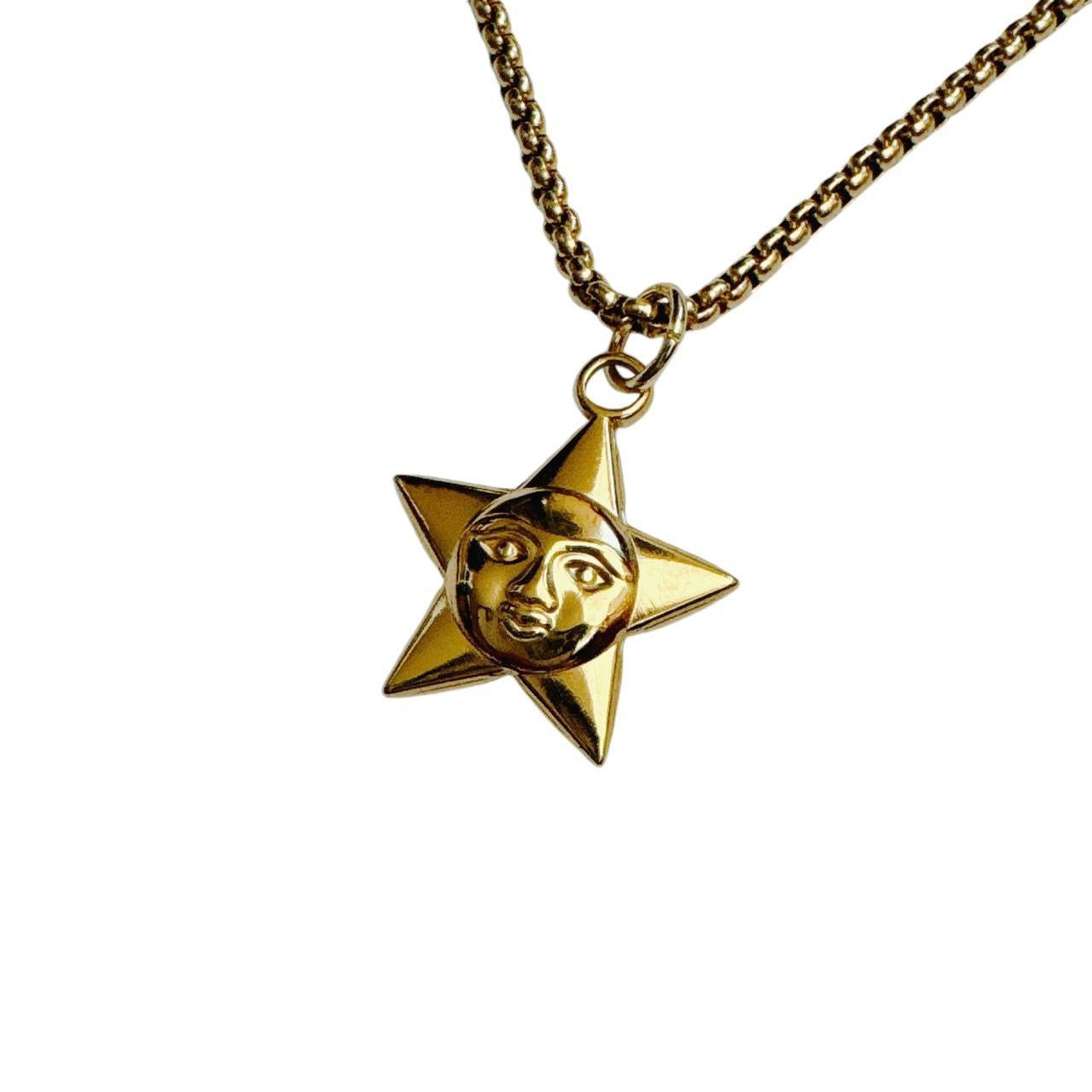 gold star moon face necklace