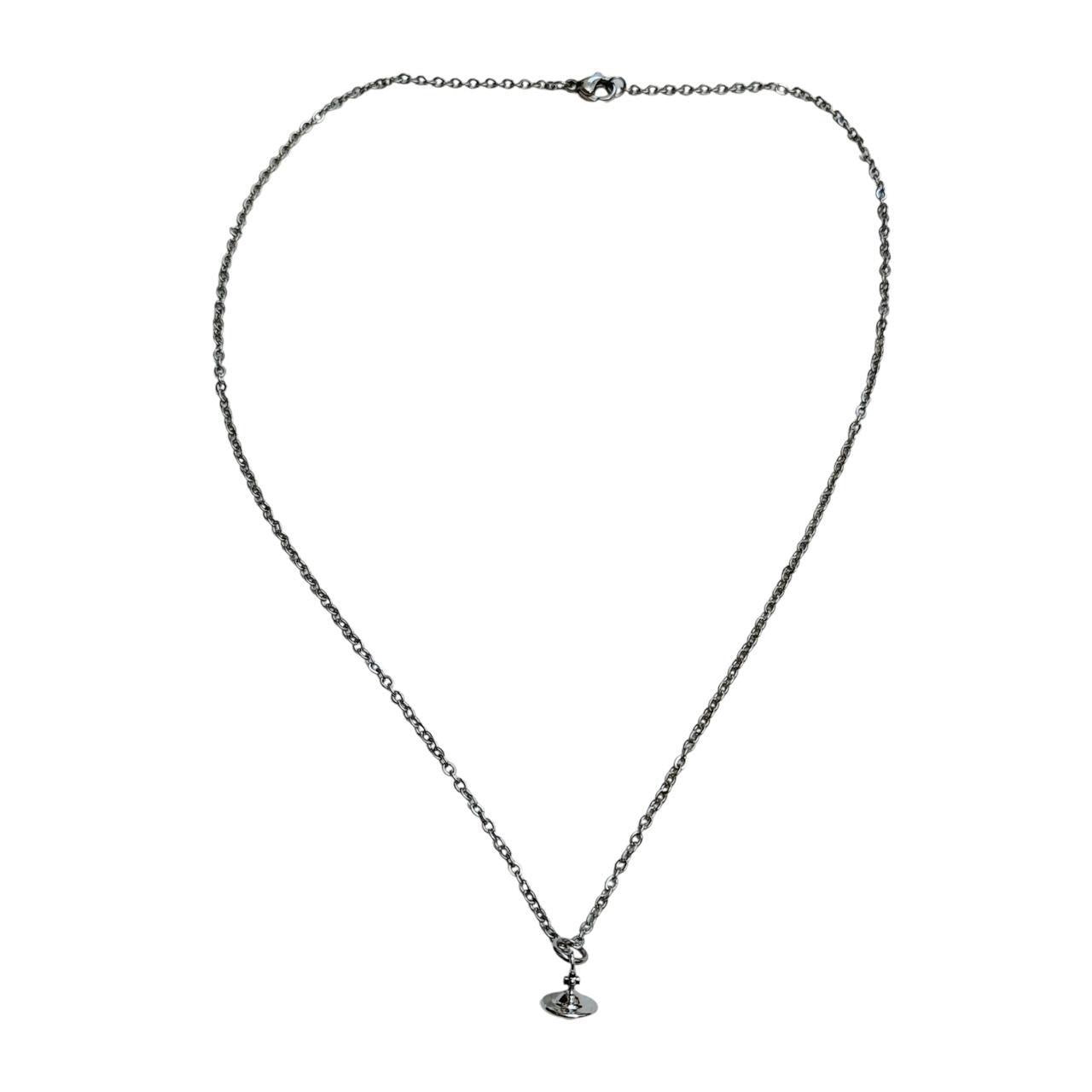 silver cross saturn necklace