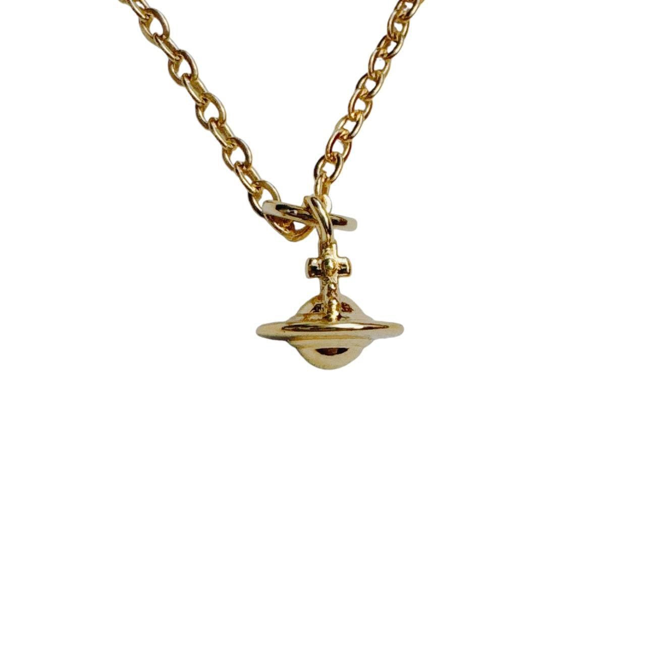 gold cross saturn necklace