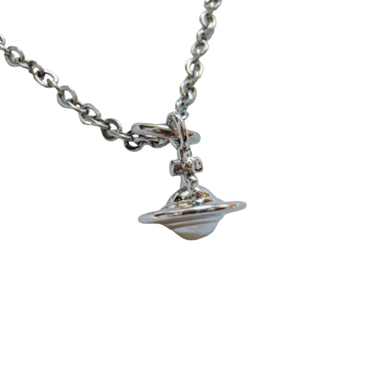 silver cross saturn necklace