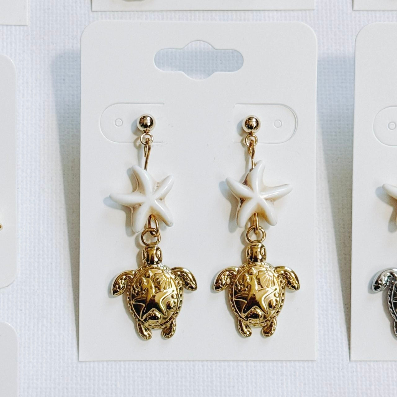 gold starfish sea turtle earrings