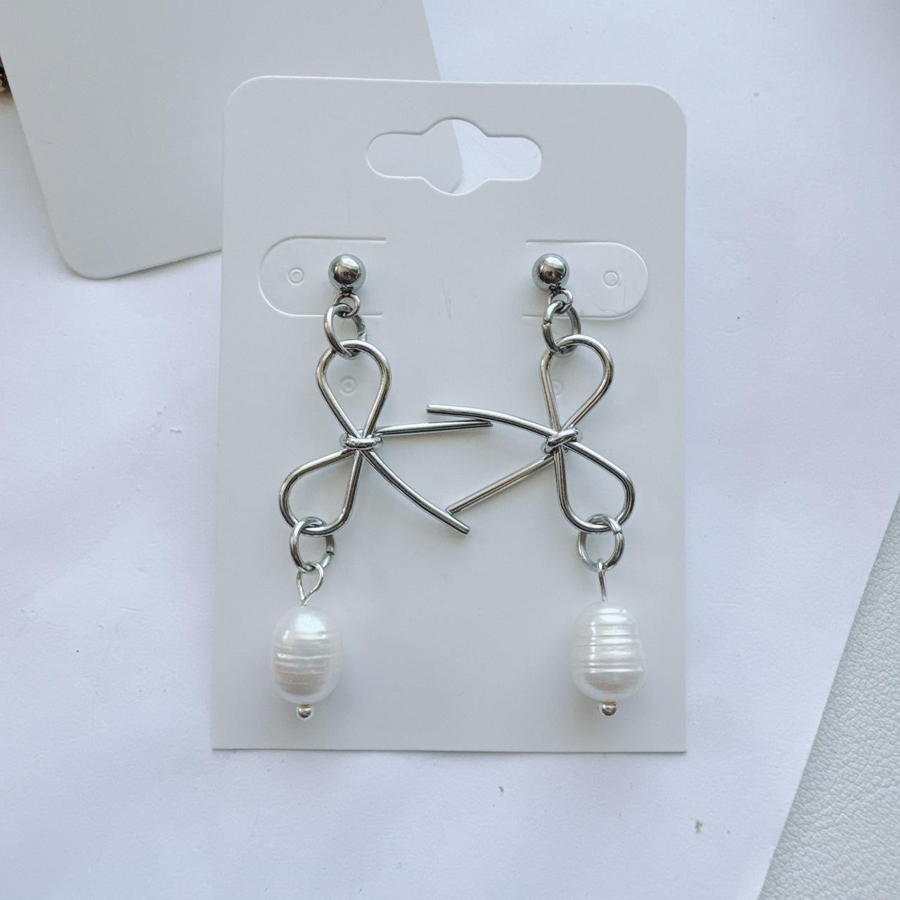 silver bow and pearl earrings