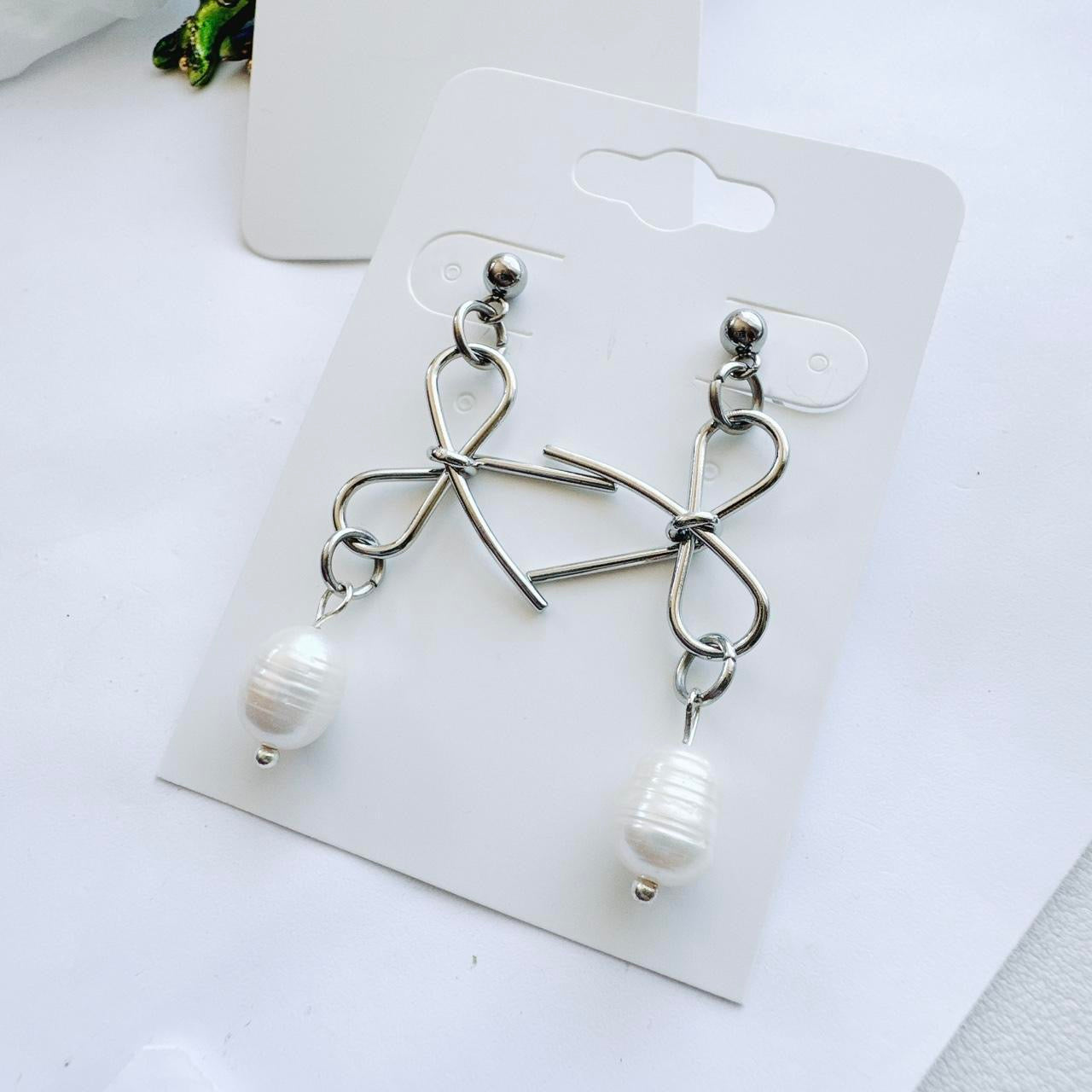 silver bow and pearl earrings