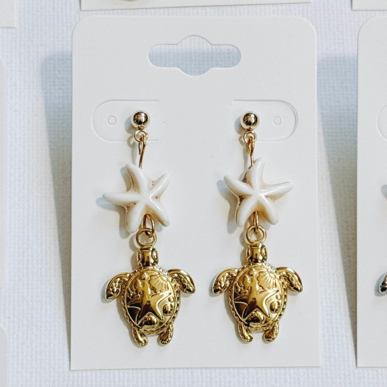 gold starfish sea turtle earrings