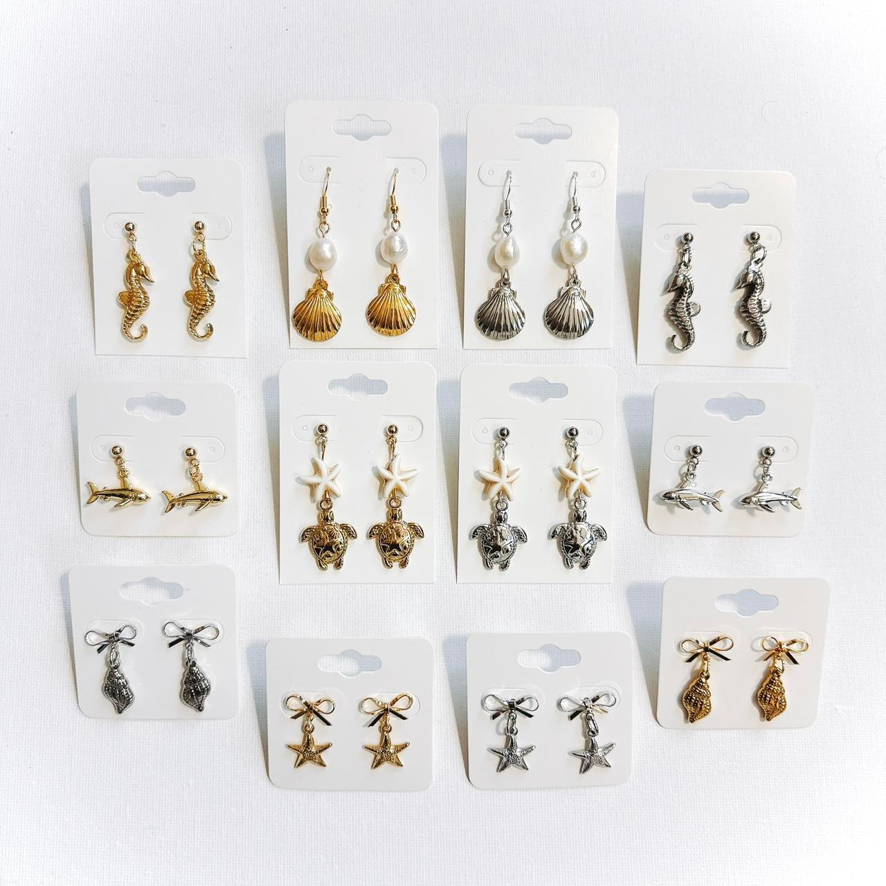 gold bow & shell earrings