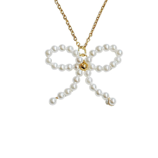 gold beaded pearl bow necklace